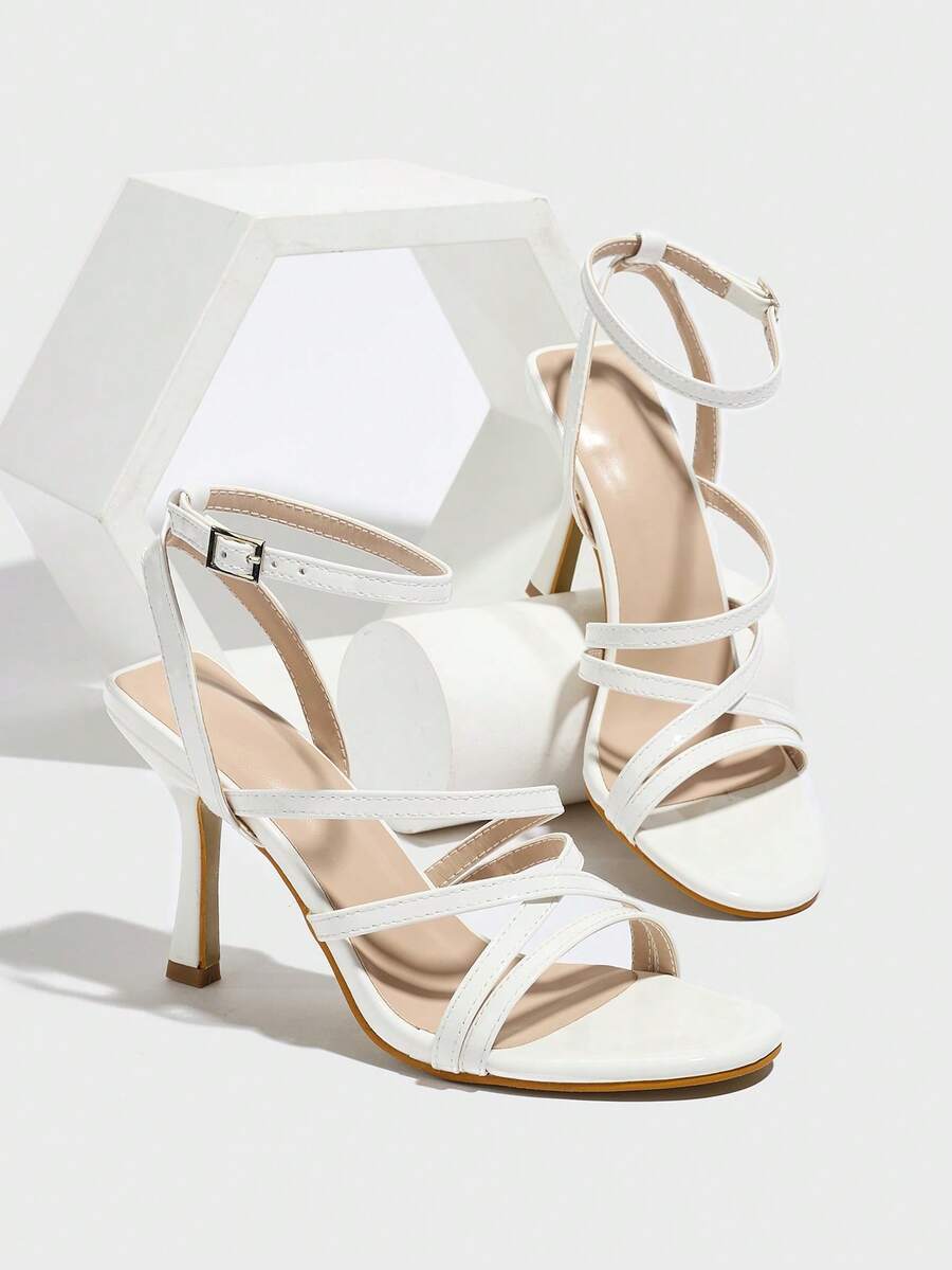 Women's square toe high heel sandals featuring crystal embellishments and crossover ankle straps with buckle closure