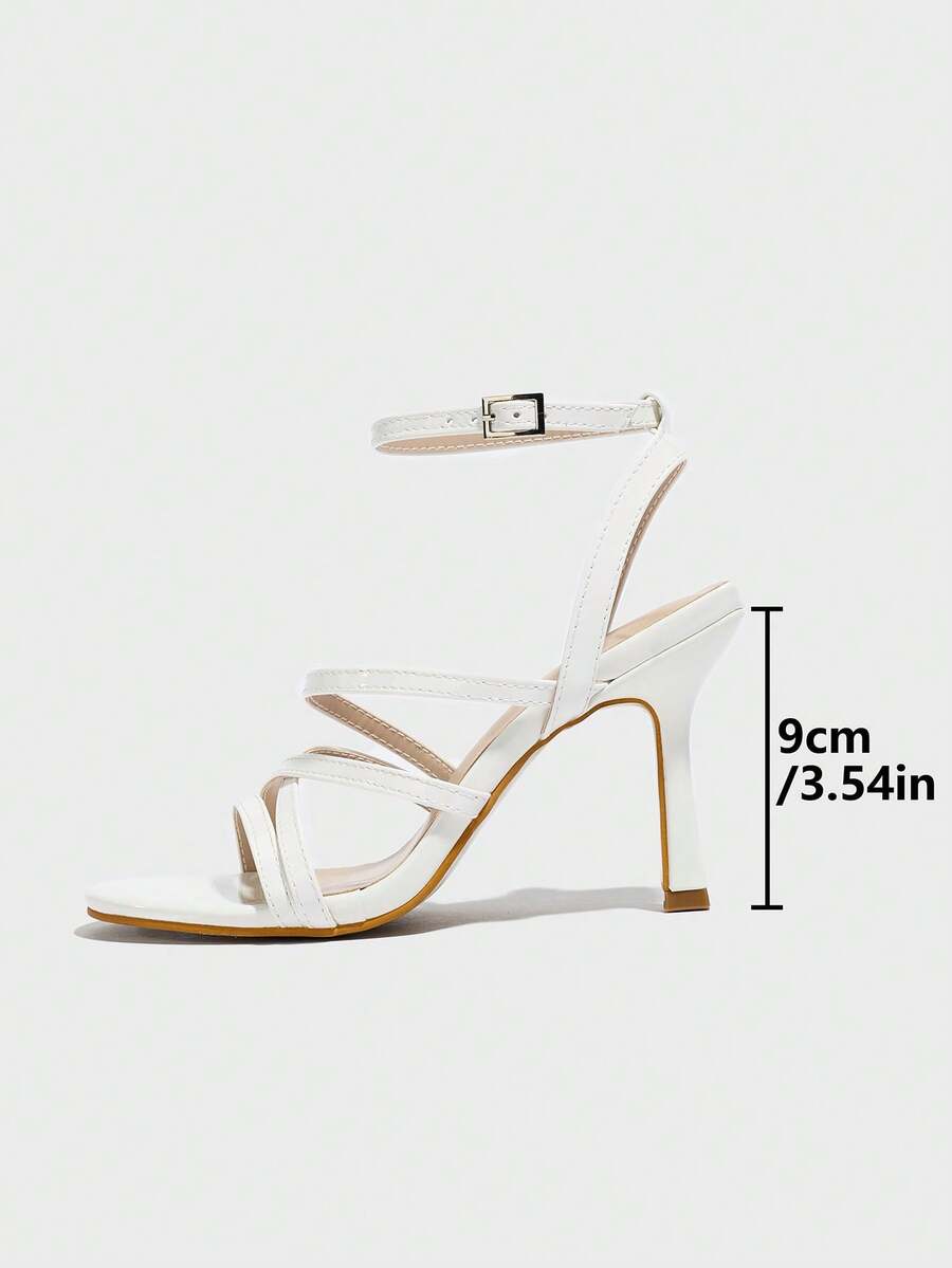 Women's square toe high heel sandals featuring crystal embellishments and crossover ankle straps with buckle closure