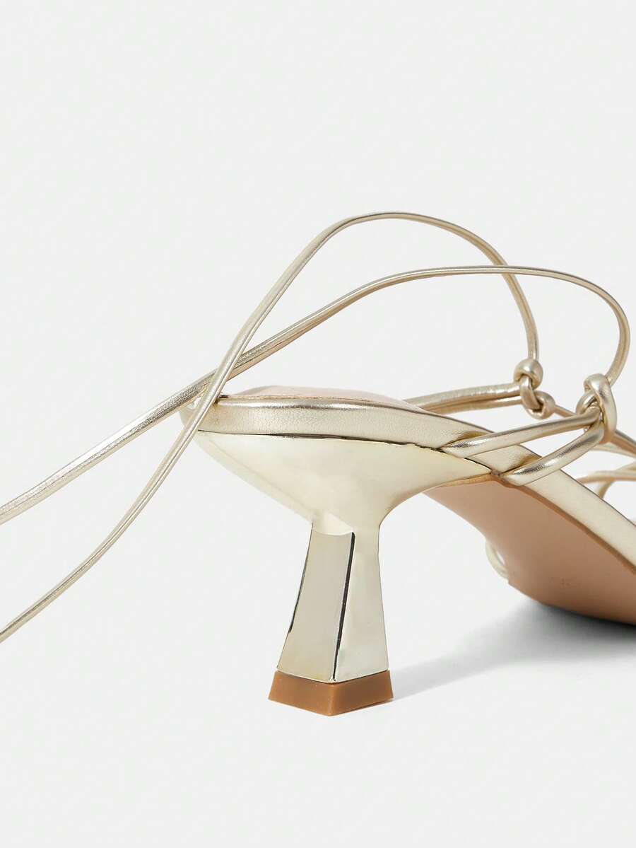 Women's square toe stiletto heel slingback sandals featuring sleek straps and buckle closure in a backless design.