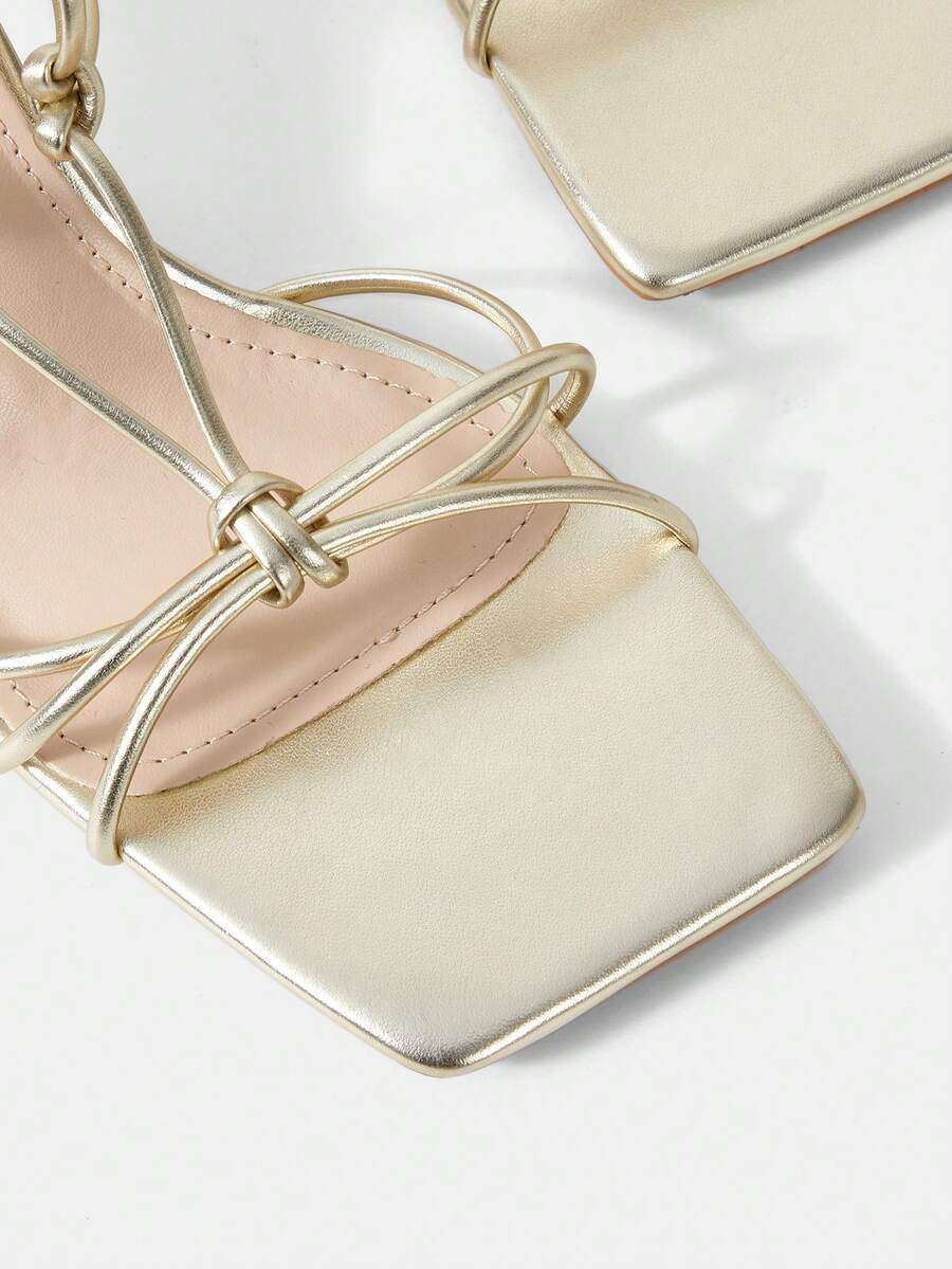 Women's square toe stiletto heel slingback sandals featuring sleek straps and buckle closure in a backless design.