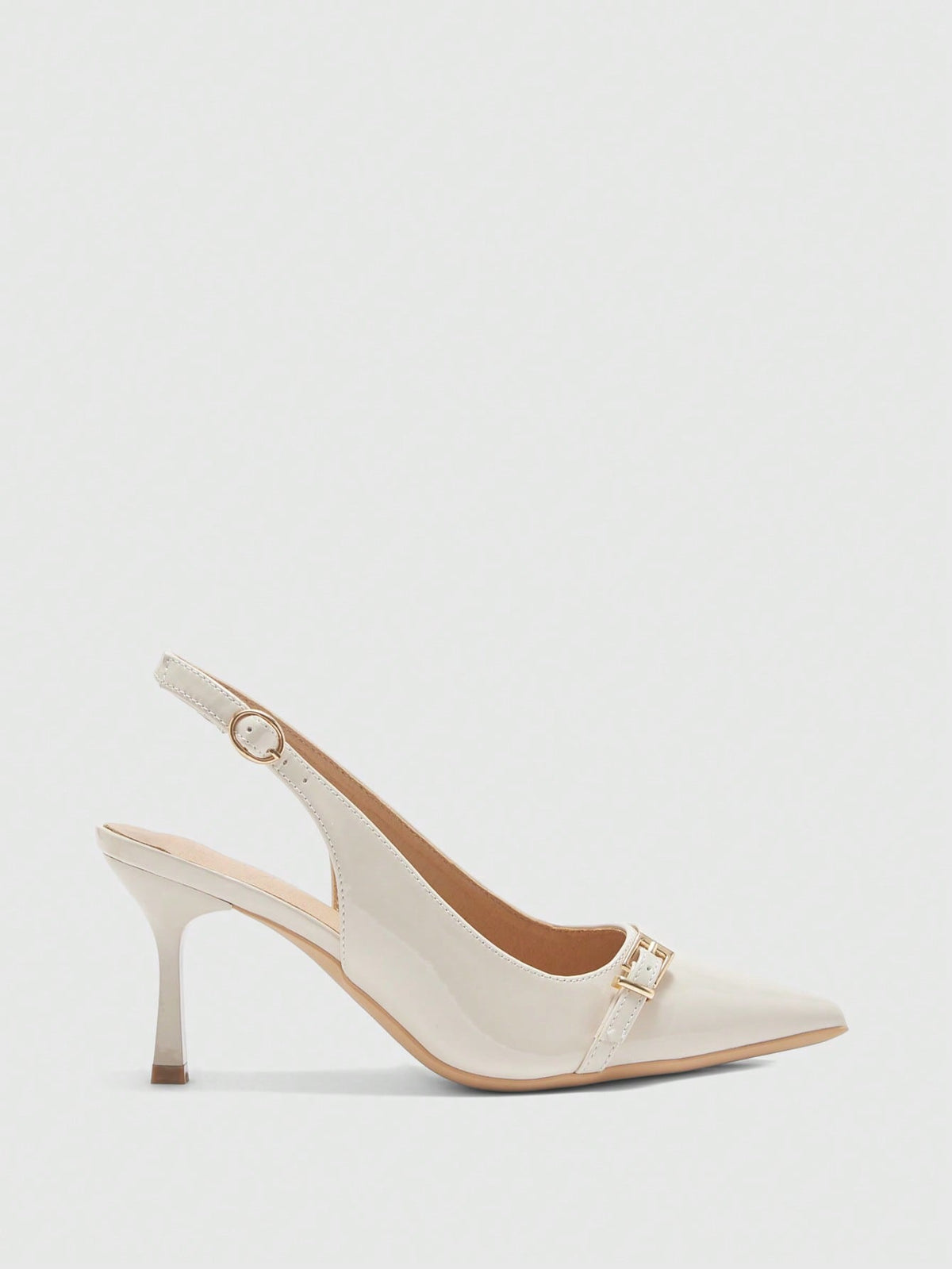 Beige pointed toe high heel pumps featuring a sleek stiletto heel and slingback strap for women.