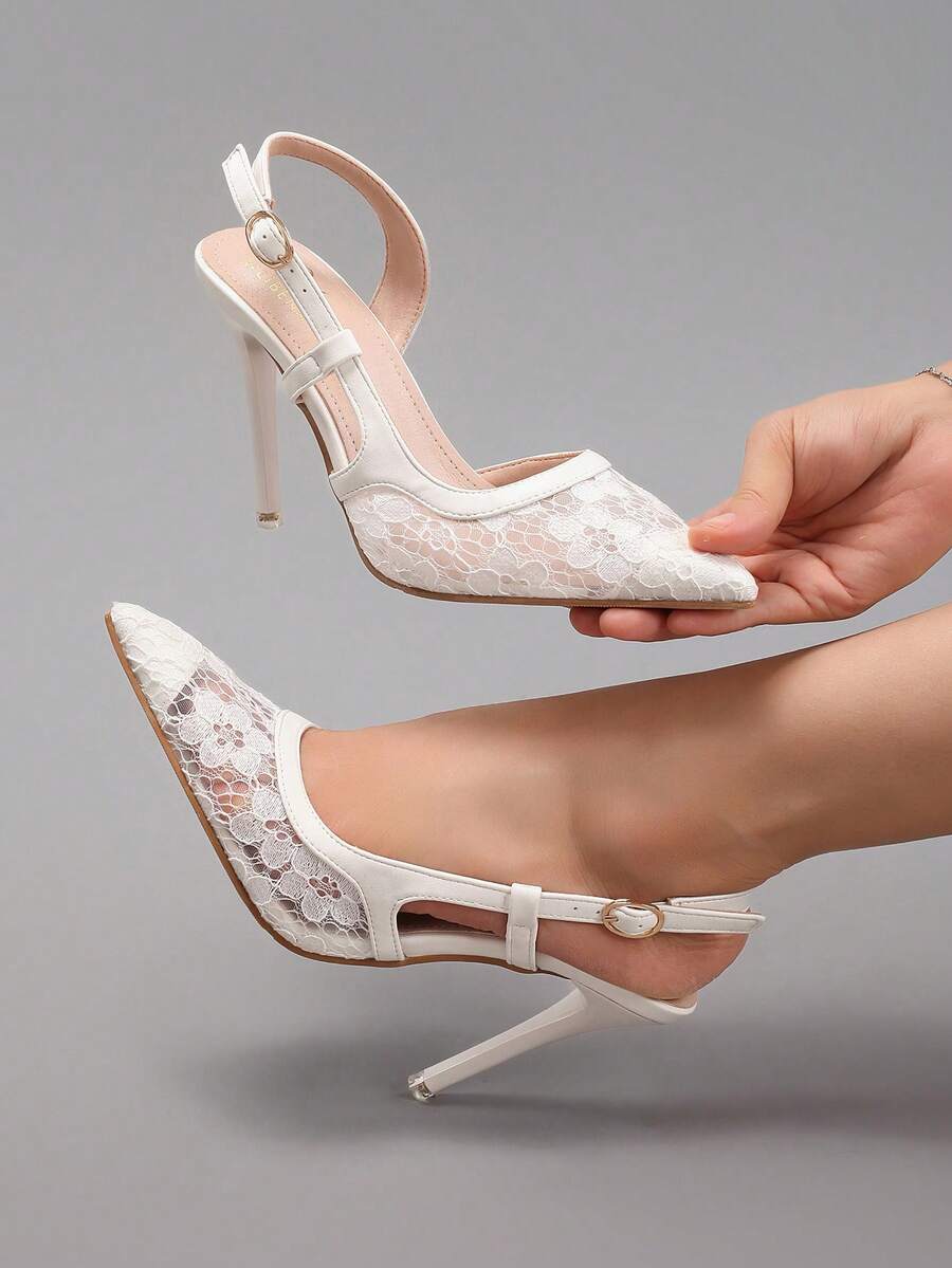Black lace pointed toe high heel pumps featuring stiletto heels and a decorative bow accent.