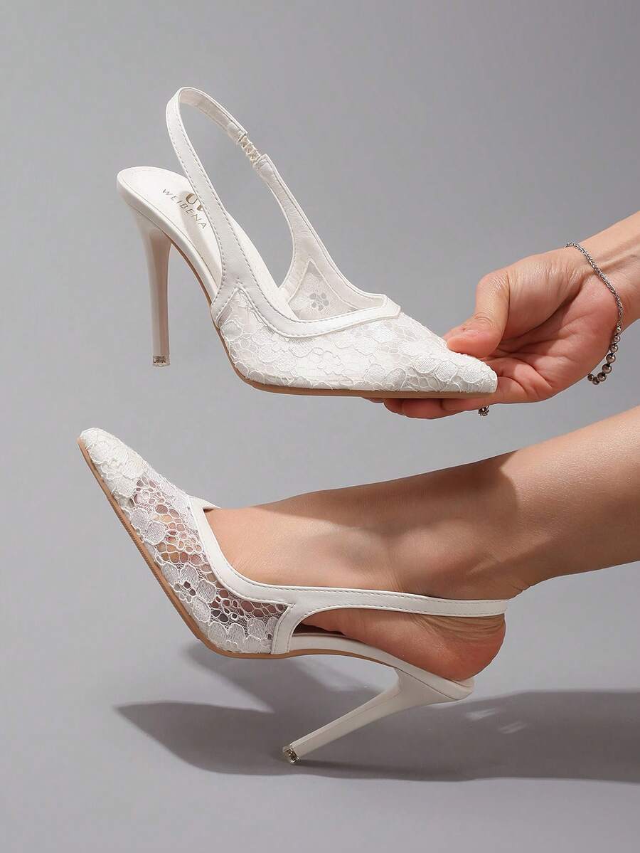 Black lace pointed toe high heel pumps featuring stiletto heels and a decorative bow accent.