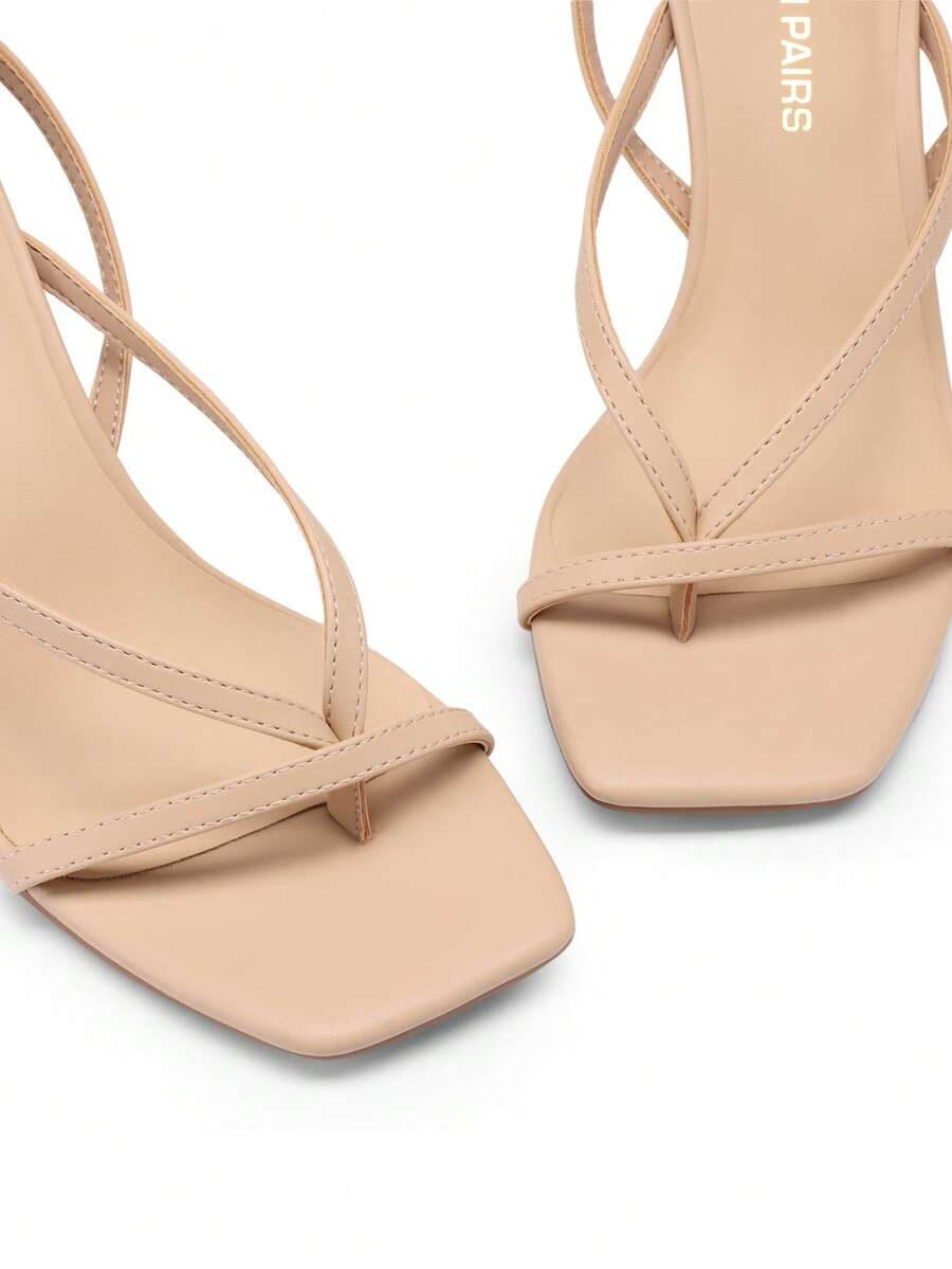 Women's metallic kitten low heel thong sandals featuring an open square toe and slip-on mule design.