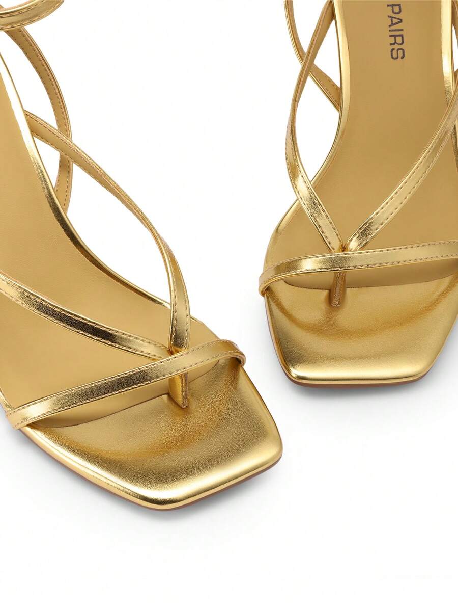 Women's metallic kitten low heel thong sandals featuring an open square toe and slip-on mule design.