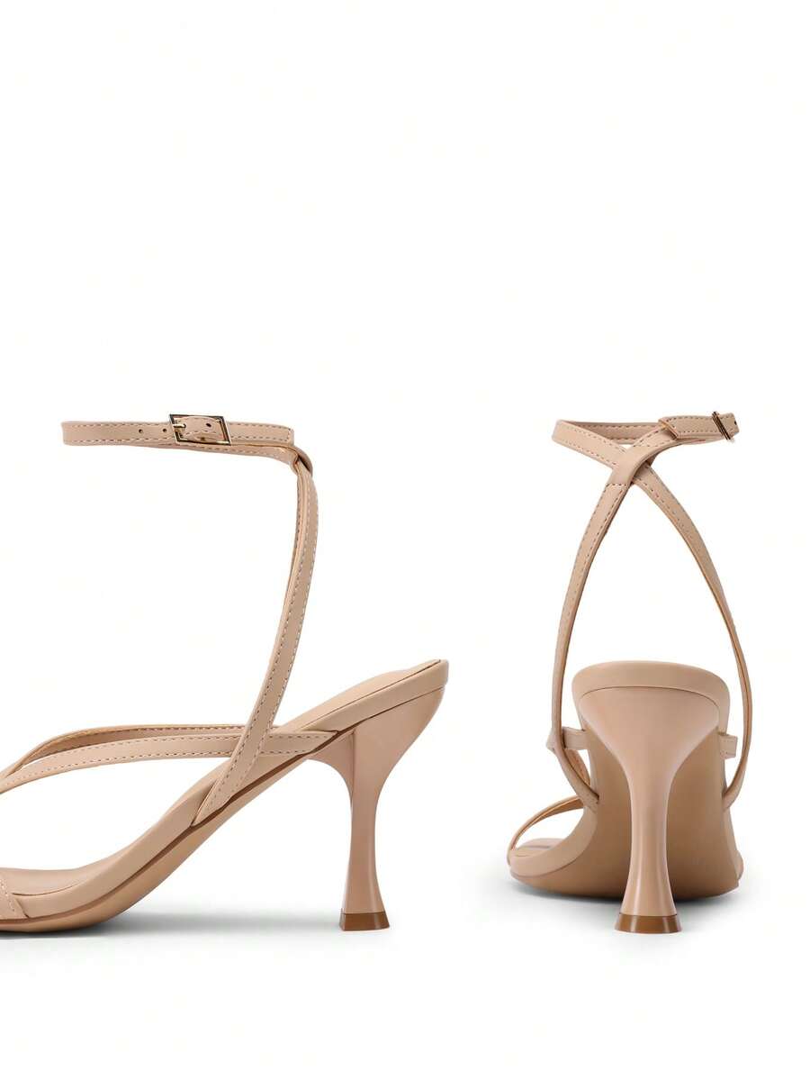 Women's metallic kitten low heel thong sandals featuring an open square toe and slip-on mule design.