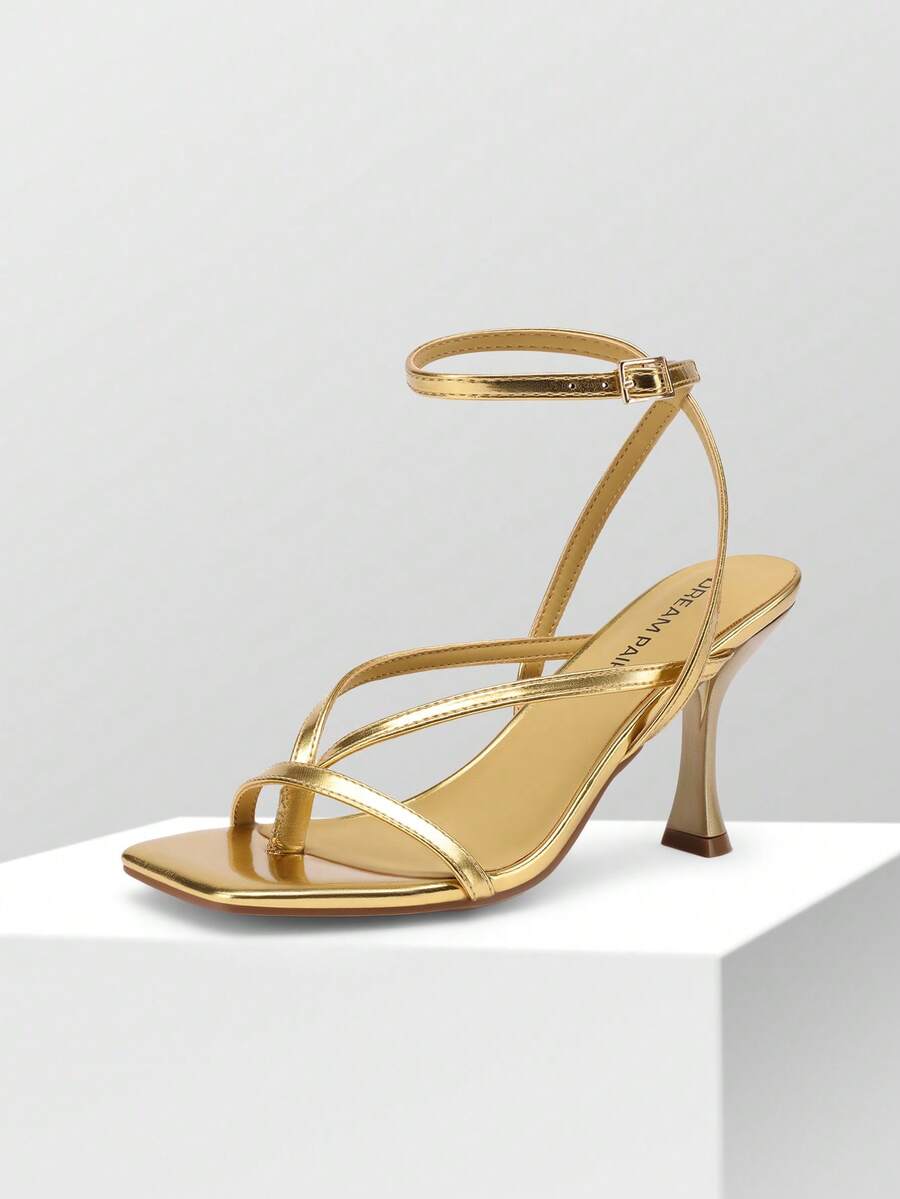 Women's metallic kitten low heel thong sandals featuring an open square toe and slip-on mule design.