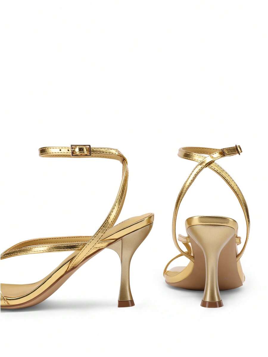 Women's metallic kitten low heel thong sandals featuring an open square toe and slip-on mule design.