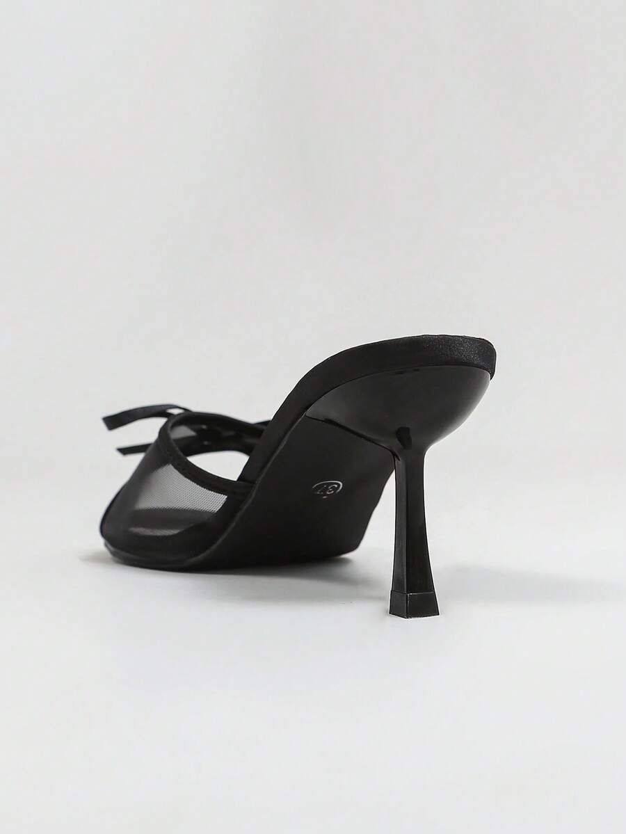 Women's black open toe mesh slide sandals with bowknot detail and stiletto heels