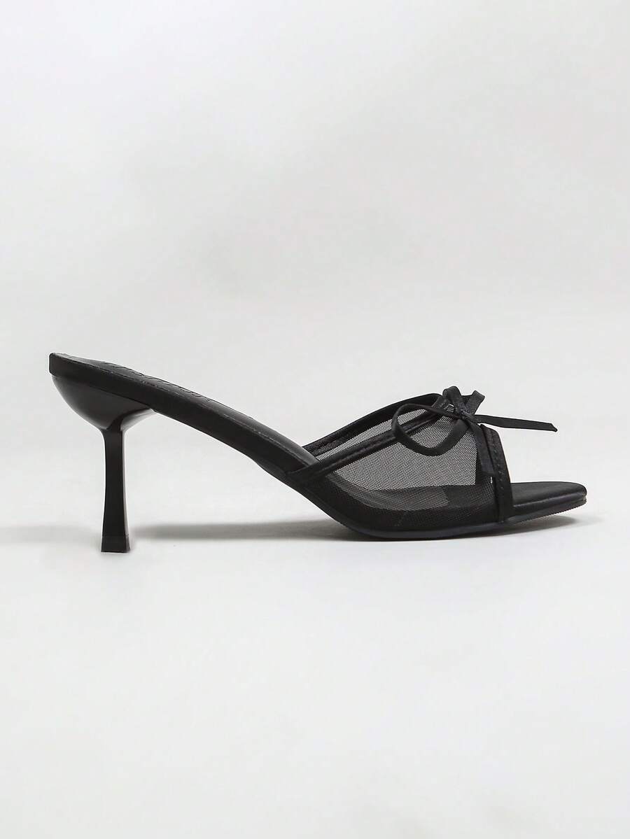 Women's black open toe mesh slide sandals with bowknot detail and stiletto heels