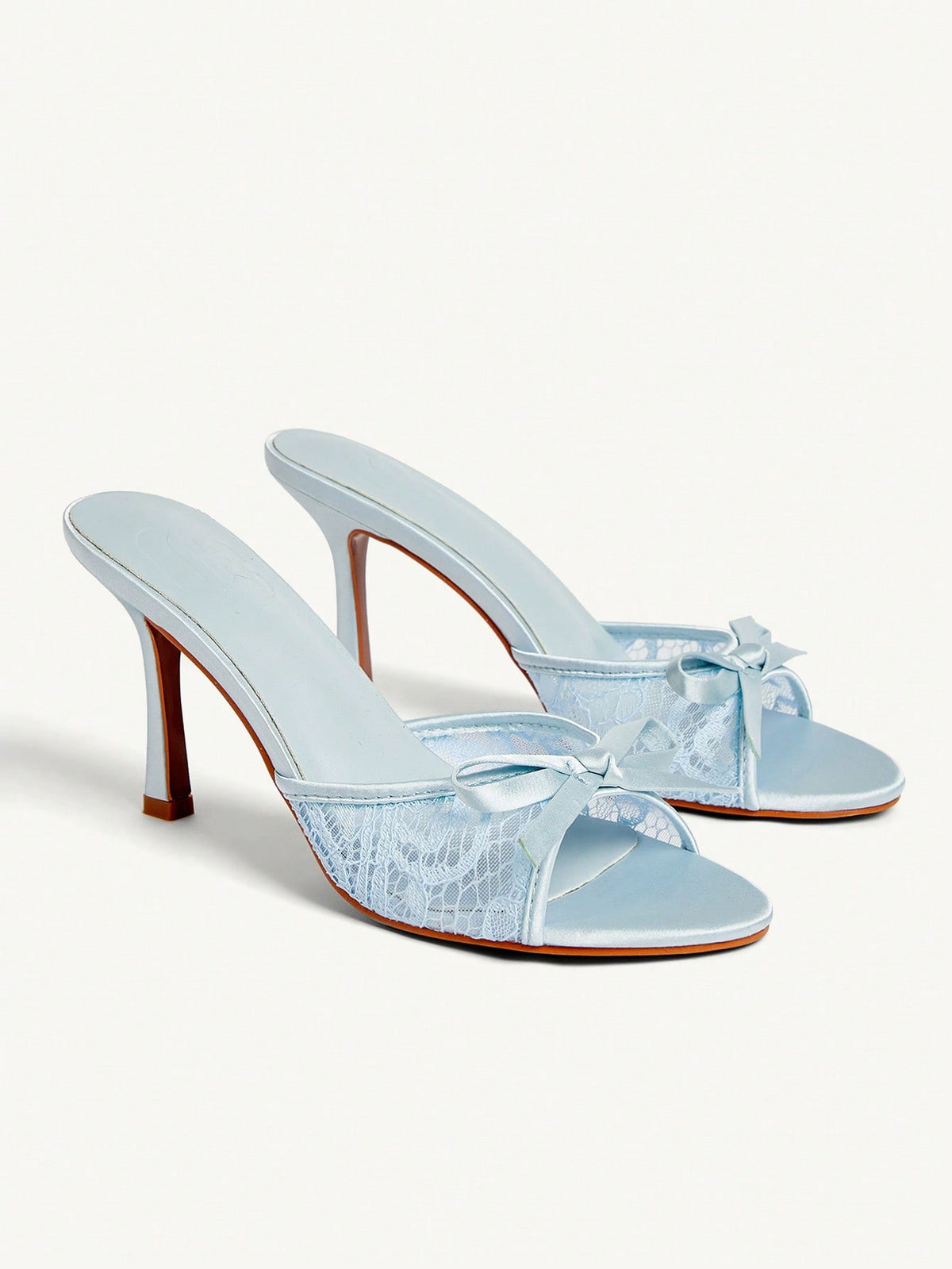 Elegant women's pointed toe high heel mules crafted from smooth PU leather with stiletto heels and delicate bow detail.