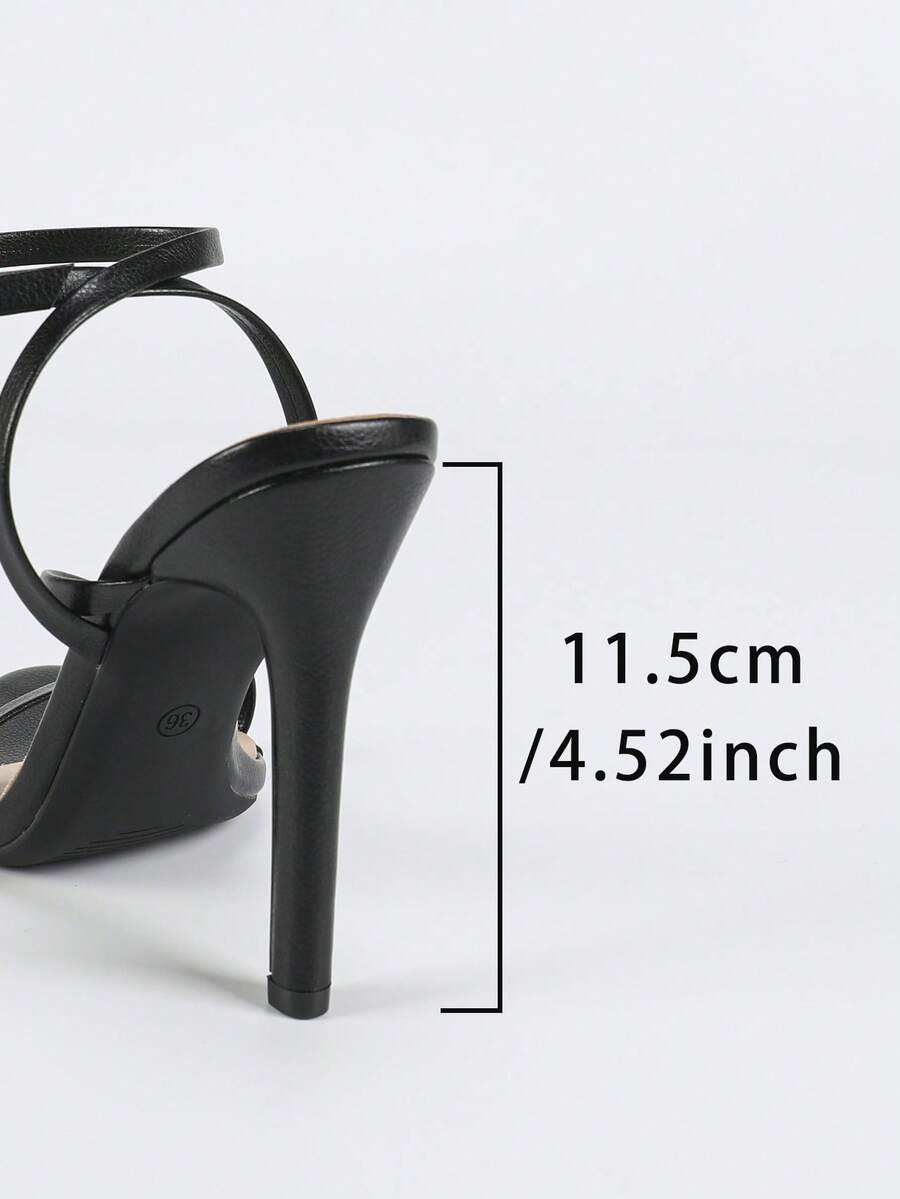 Glossy high heel sandals with open round toe, stiletto heel, and cross ankle buckle strap