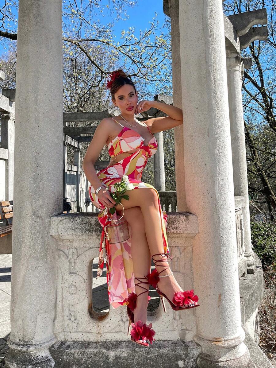 Women's open toe heeled sandals featuring 3D floral decor, satin lace-up ankle straps, and stiletto high heels.