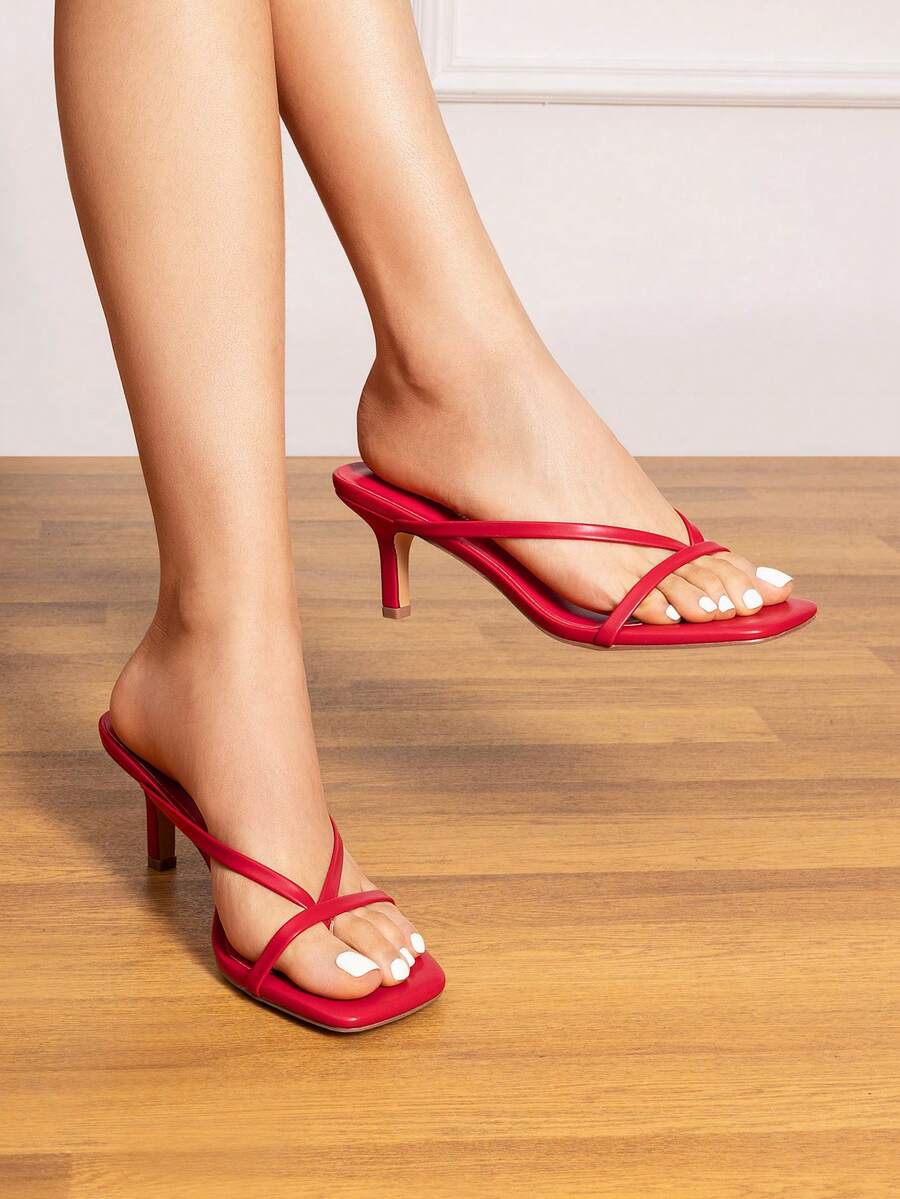 Women's metallic kitten low heel thong sandals featuring an open square toe and slip-on mule design.