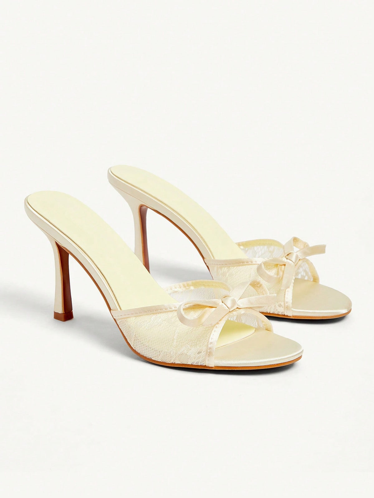 Elegant women's pointed toe high heel mules crafted from smooth PU leather with stiletto heels and delicate bow detail.
