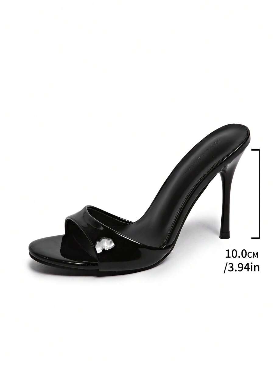 Patent leather open toe slingback slide sandals with stiletto high heels and slip on design.
