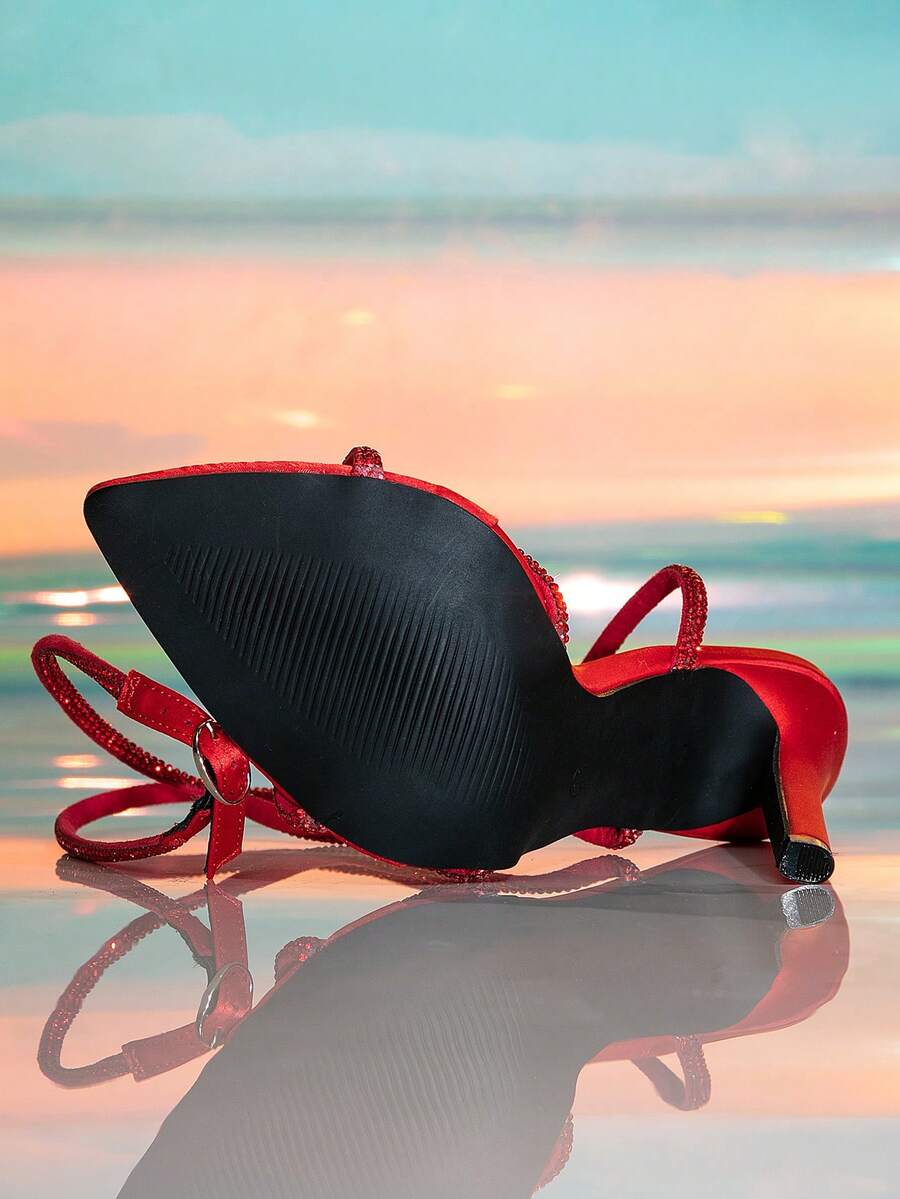 Women's strappy stiletto high heel sandals featuring an open toe design and adjustable buckle closure
