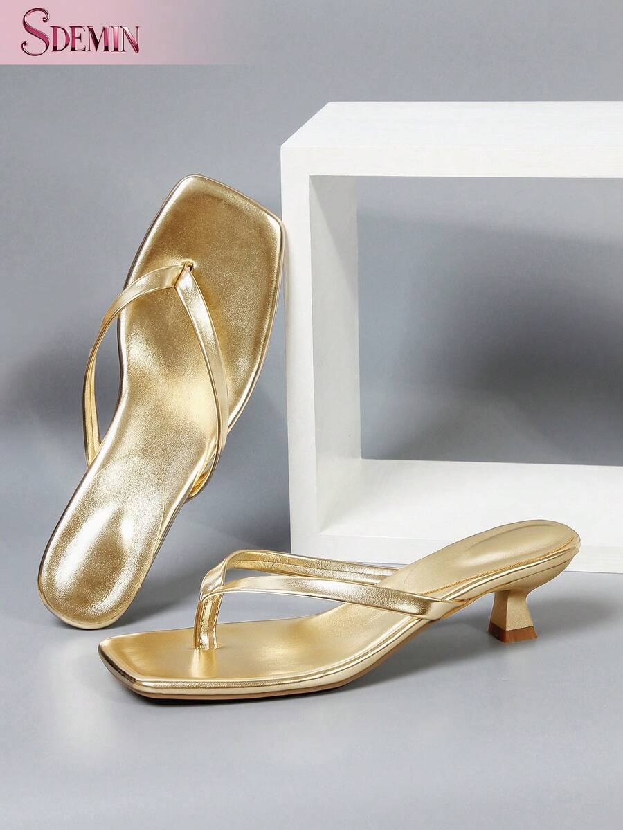 Women's slip-on kitten high heel sandals featuring a square toe and toe post thong design in solid PU leather.