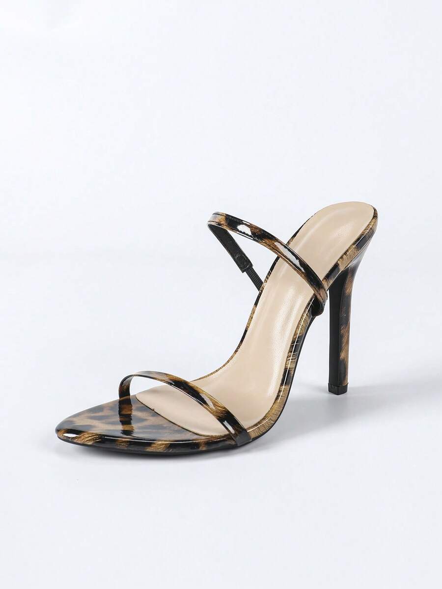 Women's stiletto high heel sandals with round open toe and back ankle strap in solid finish.