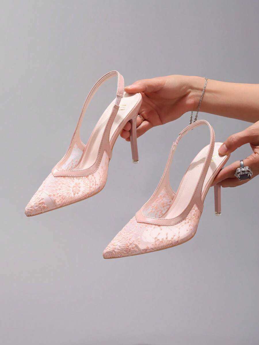 Black lace pointed toe high heel pumps featuring stiletto heels and a decorative bow accent.