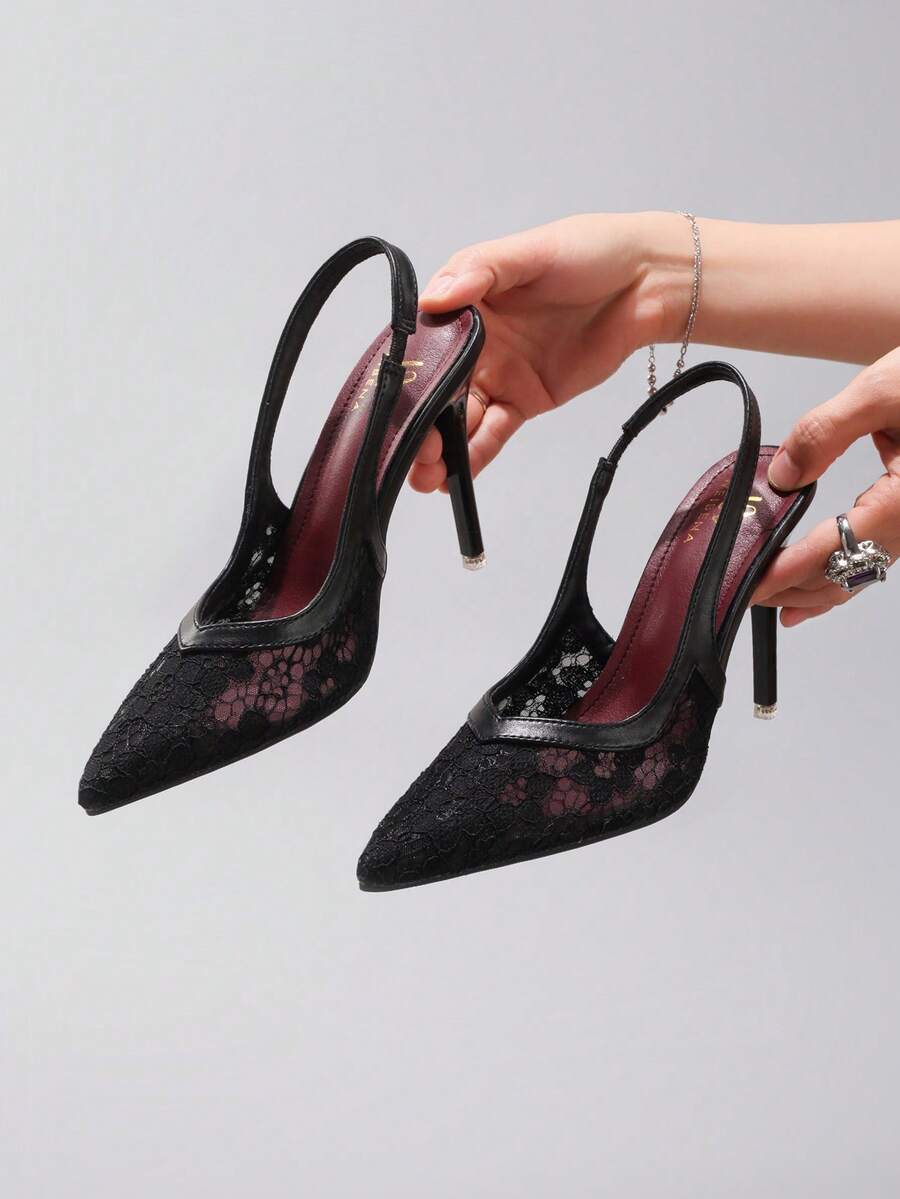 Black lace pointed toe high heel pumps featuring stiletto heels and a decorative bow accent.