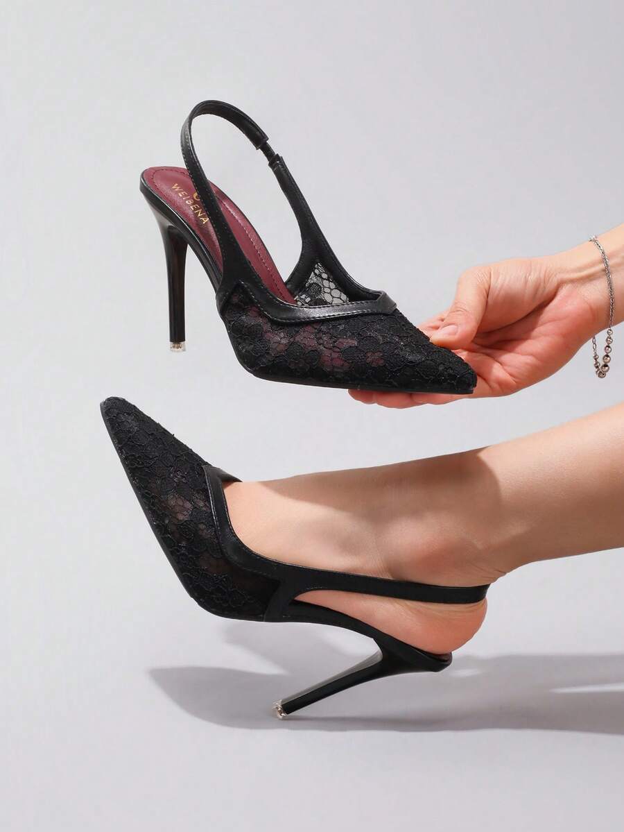 Black lace pointed toe high heel pumps featuring stiletto heels and a decorative bow accent.