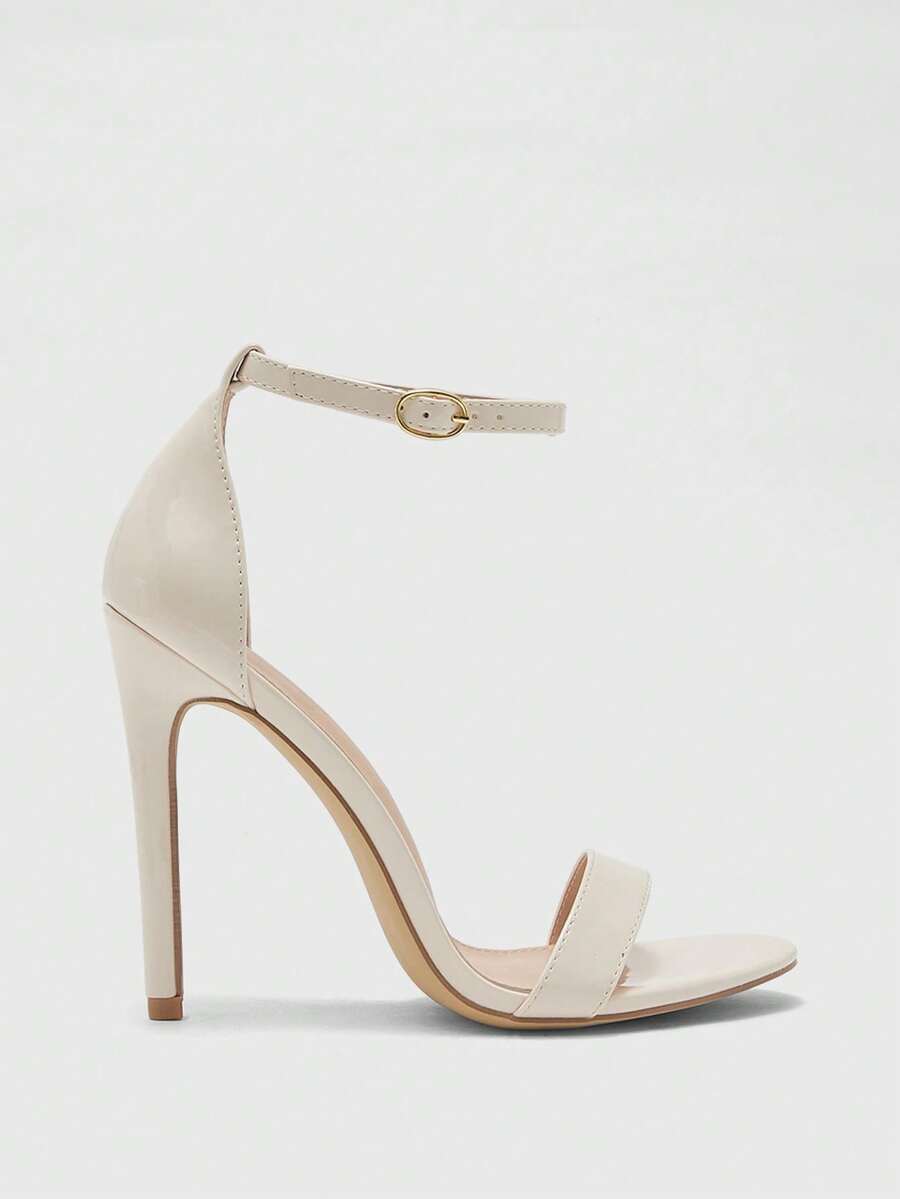 Women's stiletto sandals featuring an ankle strap buckle closure and classic round open toe design.