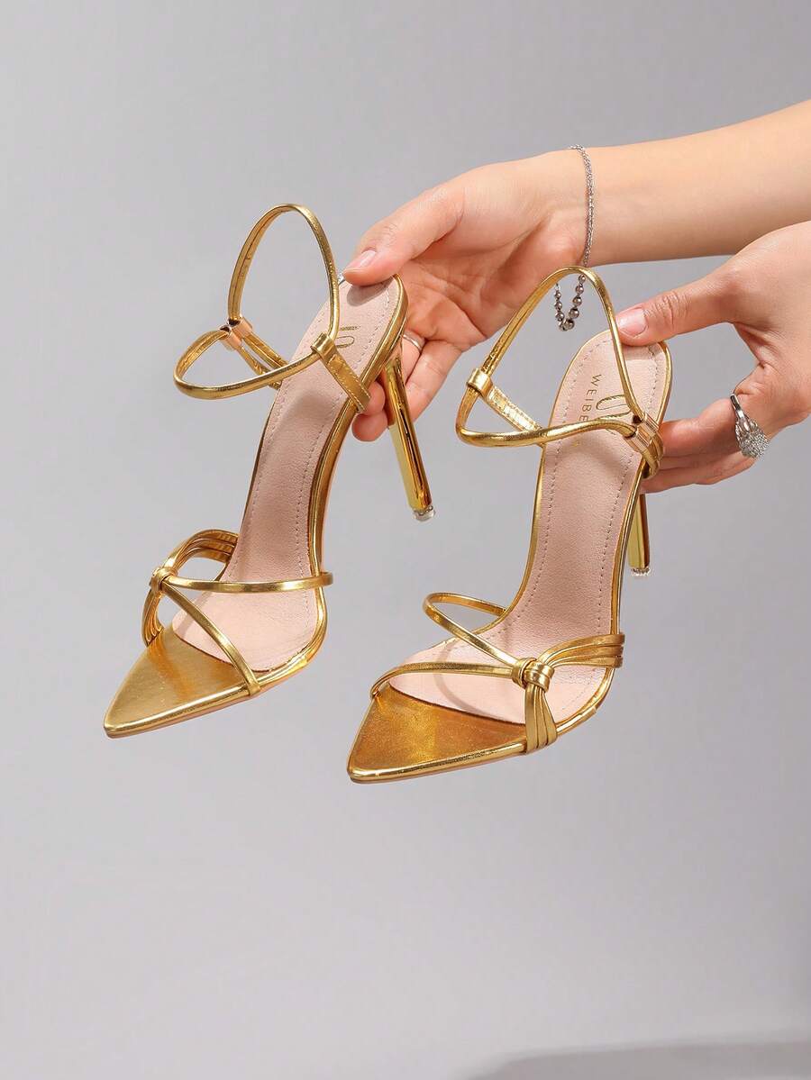 Lace stiletto high heel sandals with pointed open toe, ankle strap buckle, and bow detail