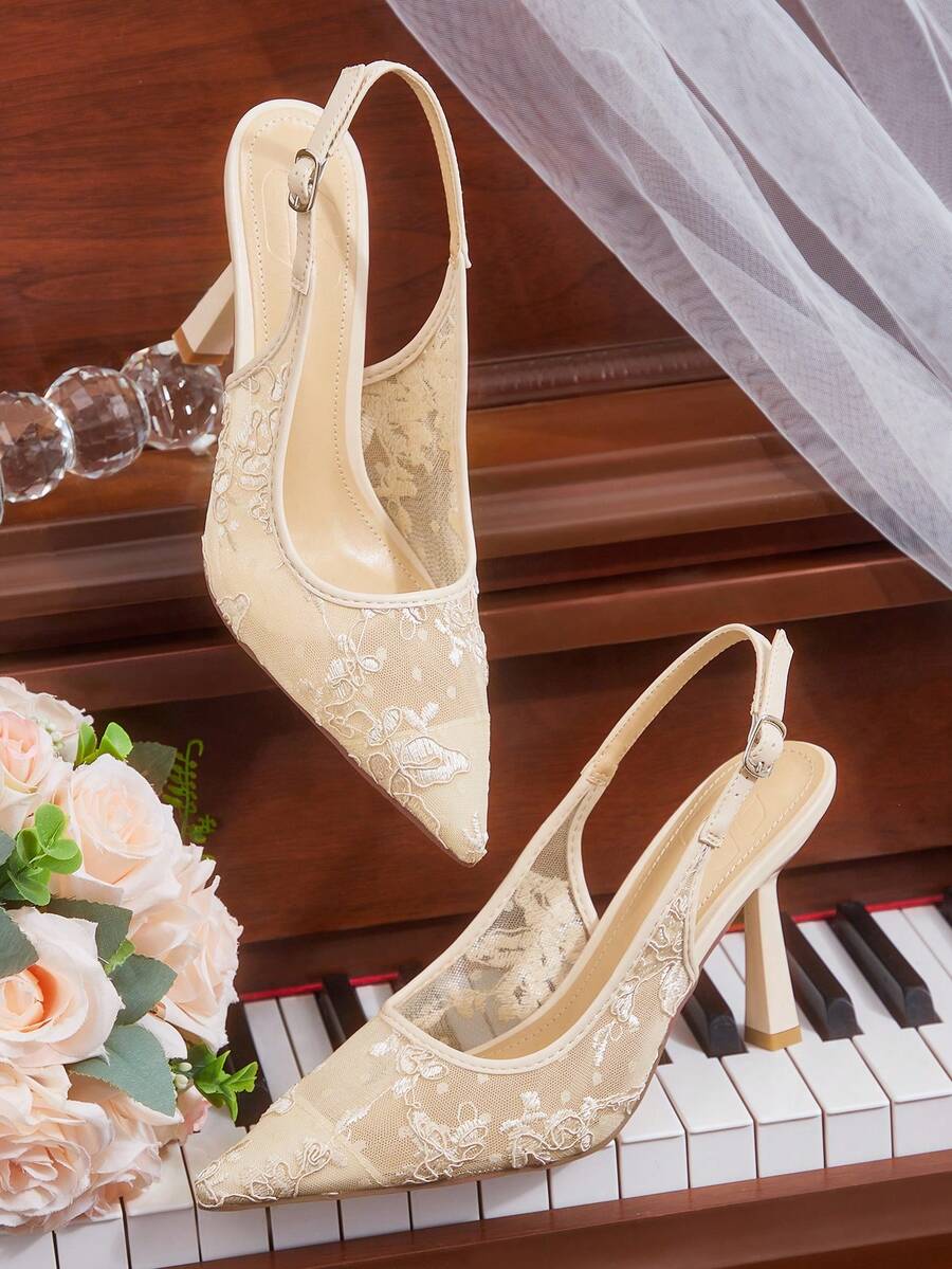 High heel wedding slingback pumps featuring delicate lace mesh upper, pointed toe, buckle strap, and stiletto heel