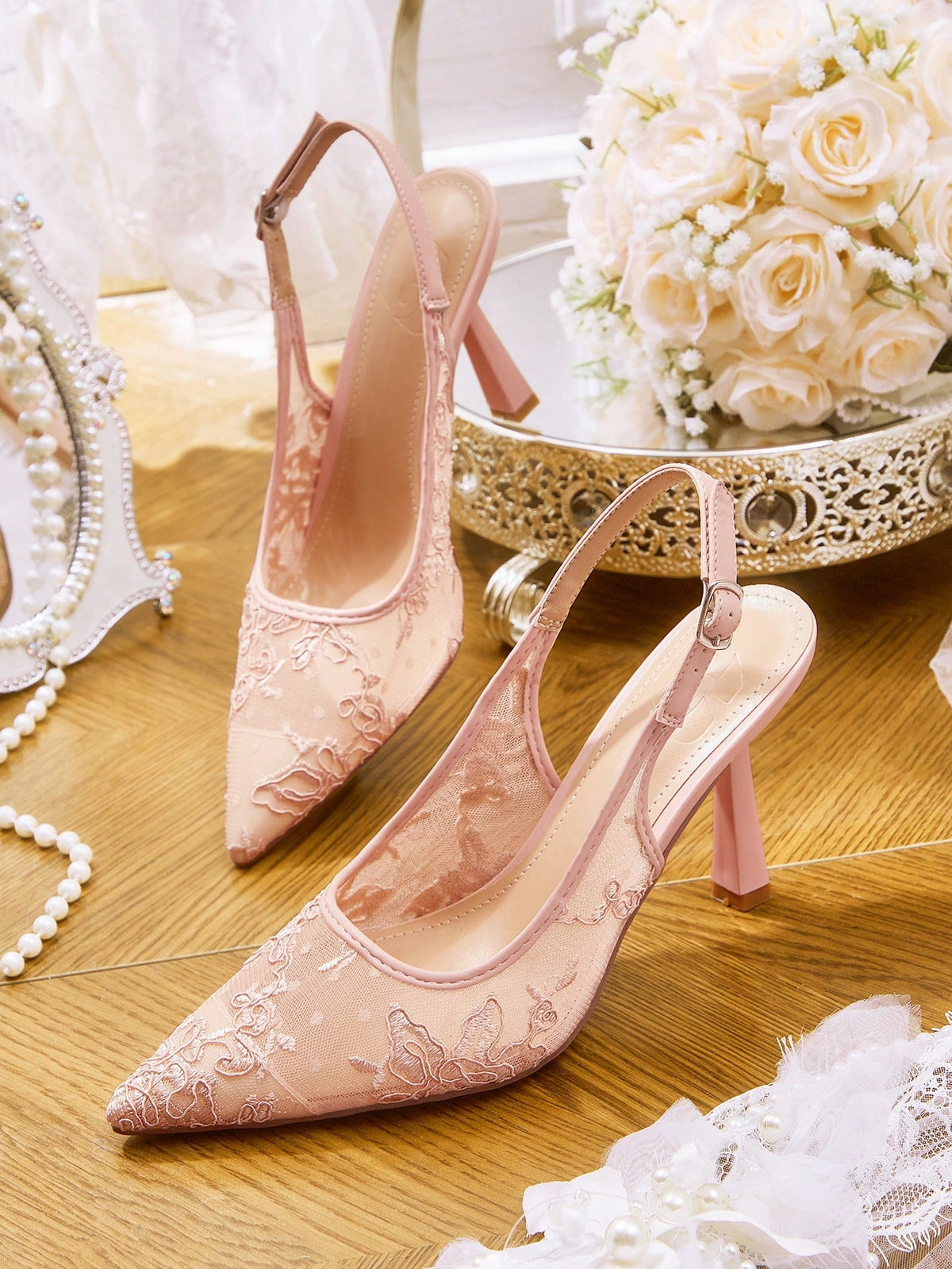High heel wedding slingback pumps featuring delicate lace mesh upper, pointed toe, buckle strap, and stiletto heel
