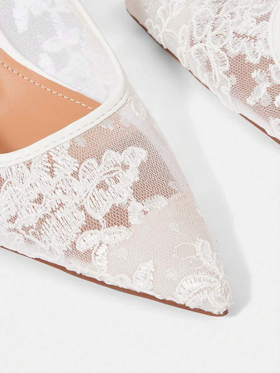 High heel wedding slingback pumps featuring delicate lace mesh upper, pointed toe, buckle strap, and stiletto heel