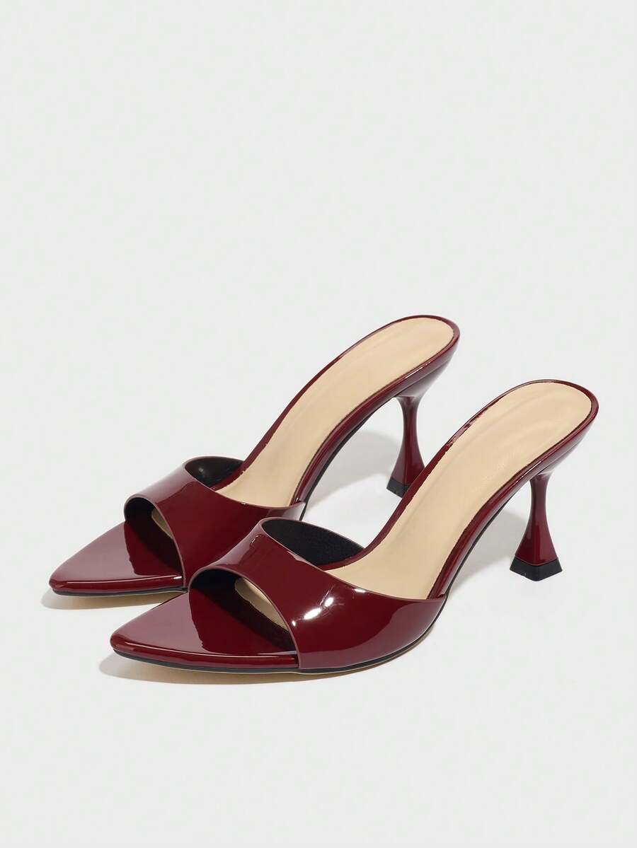 Women's pointed toe high heel mule sandals featuring a sleek slip-on design with elegant lace embroidery detailing