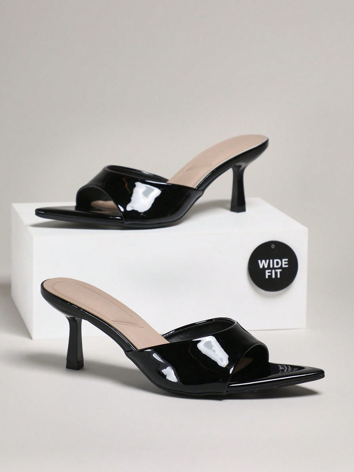 Women's wide-fit stiletto heel sandals in glossy patent PU with a sleek point toe design