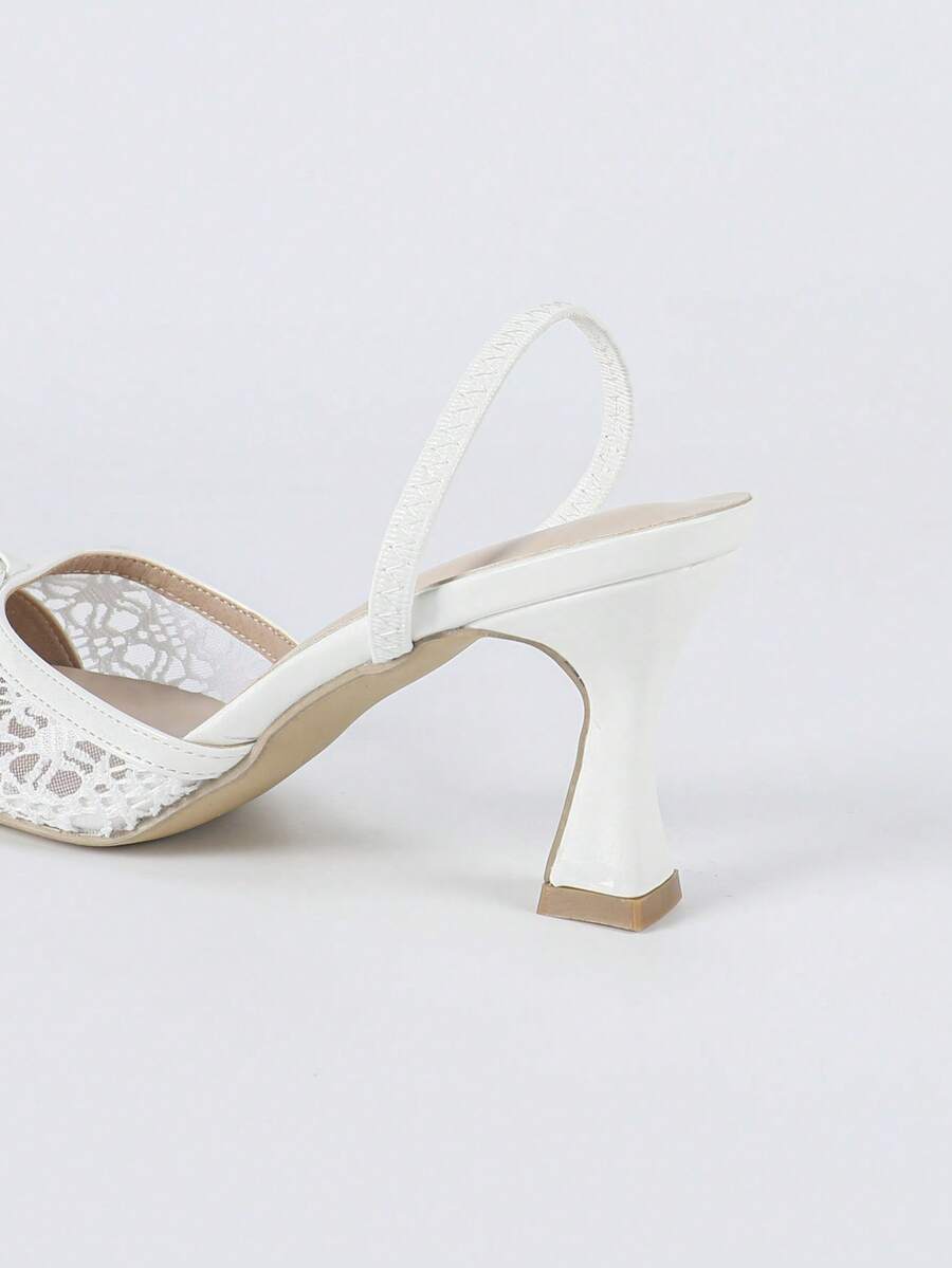 Pointed toe stiletto high heels featuring white mesh lace upper, bowknot accent, and slingback buckle strap.