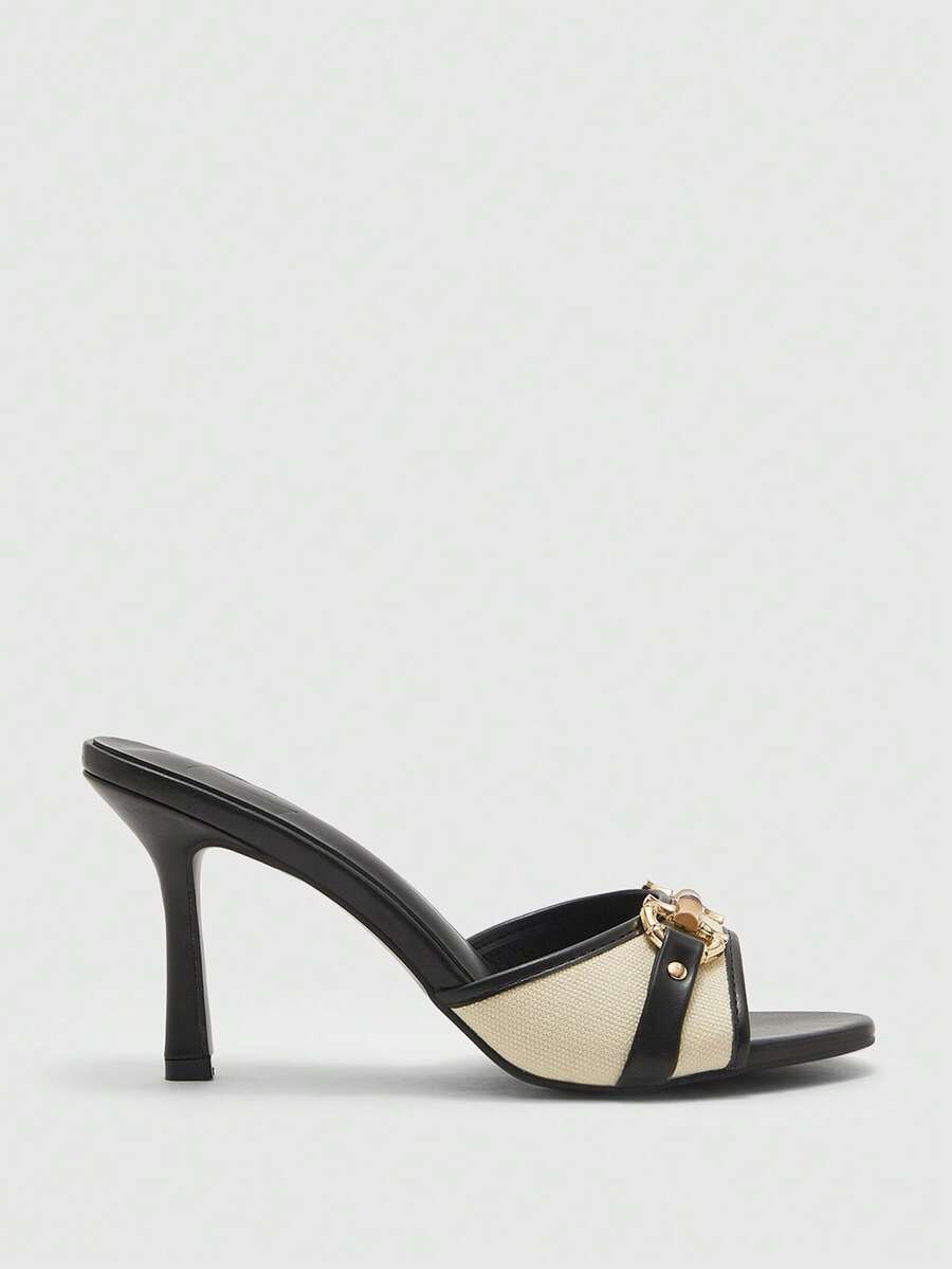 Women's open toe high heel slingback sandals featuring metal bamboo joint accent and stiletto heels.
