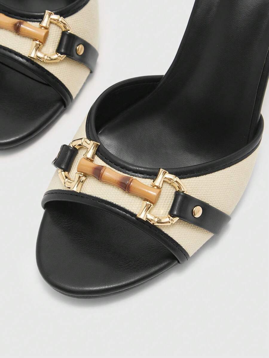 Women's open toe high heel slingback sandals featuring metal bamboo joint accent and stiletto heels.