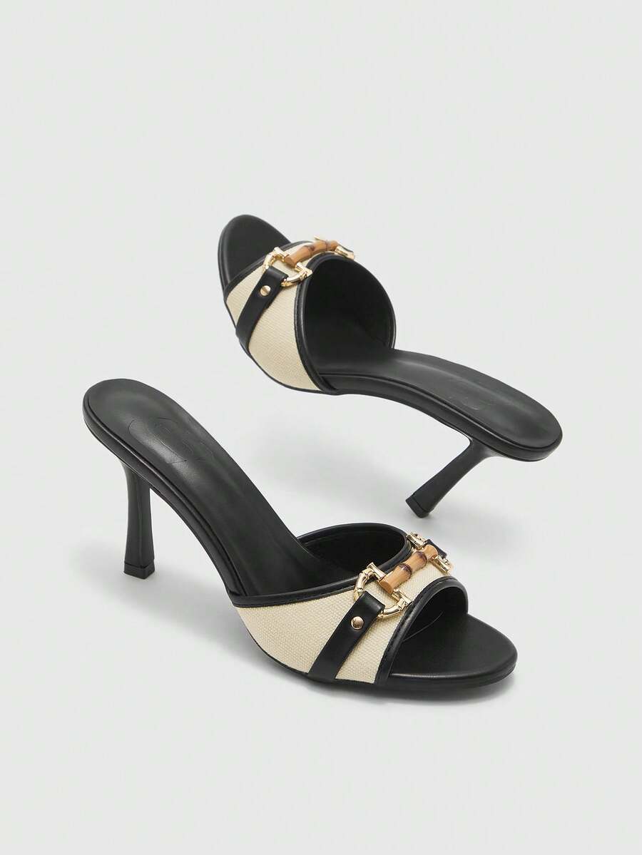 Women's open toe high heel slingback sandals featuring metal bamboo joint accent and stiletto heels.