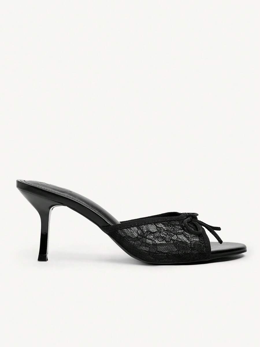 Open toe high heel slide sandals featuring lace details and a bow accent on the upper strap.