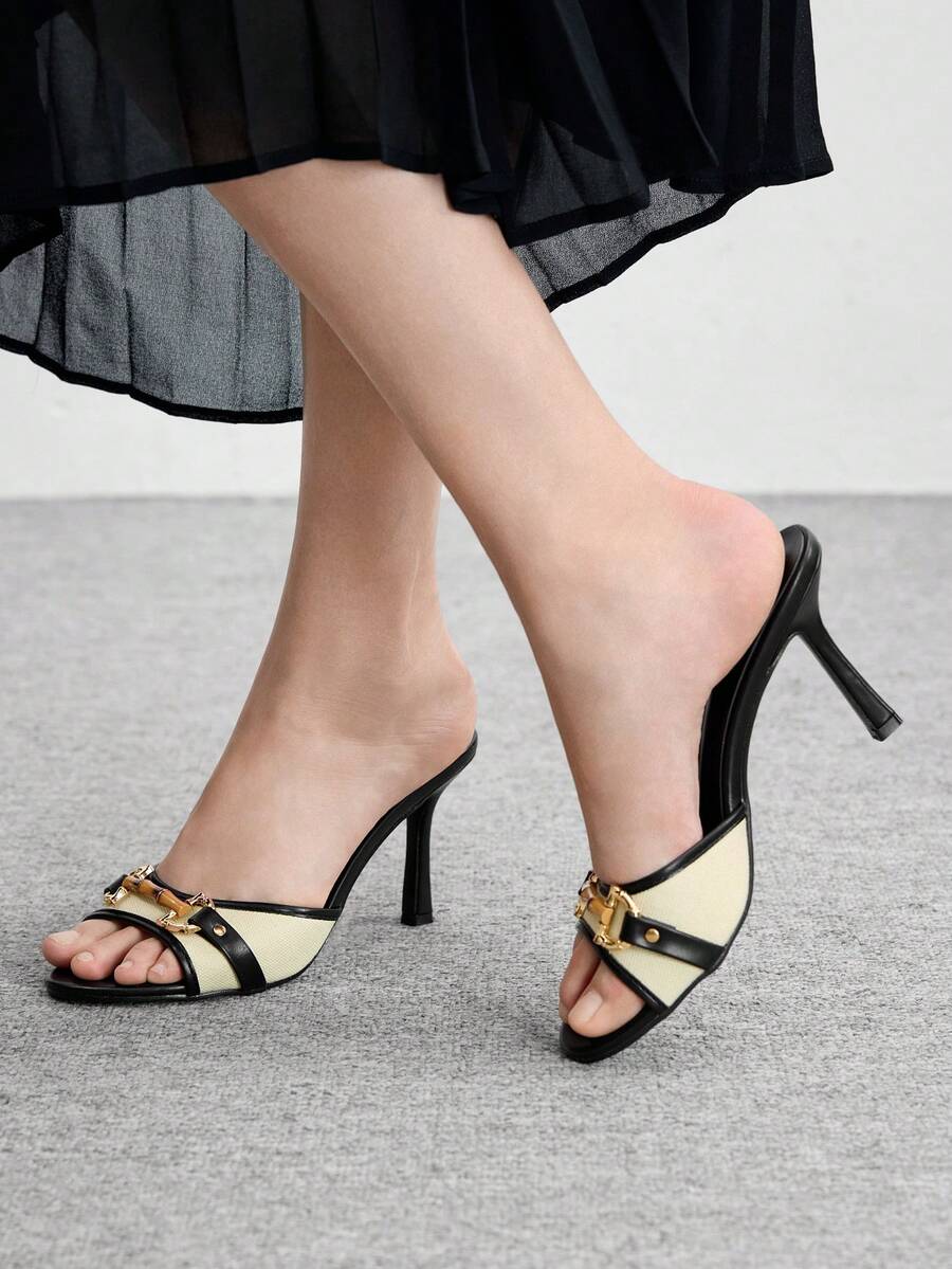Women's open toe high heel slingback sandals featuring metal bamboo joint accent and stiletto heels.