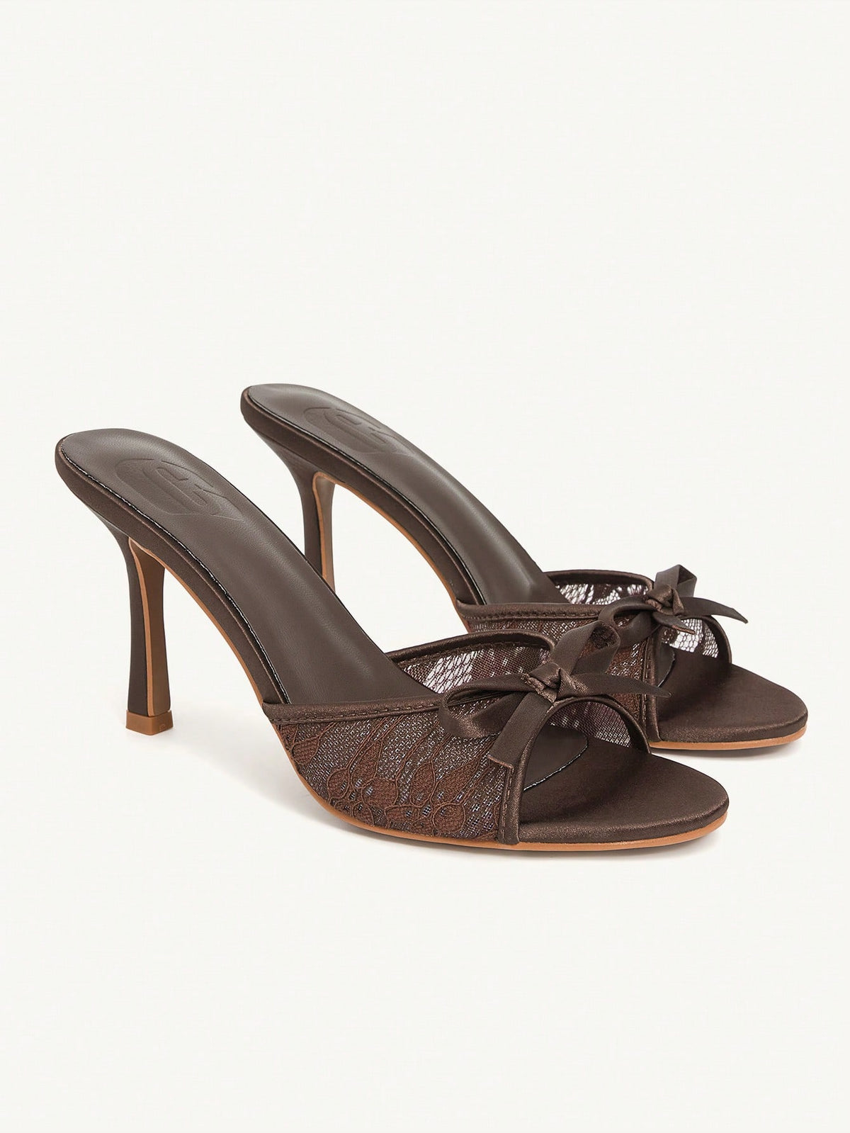 Elegant women's pointed toe high heel mules crafted from smooth PU leather with stiletto heels and delicate bow detail.