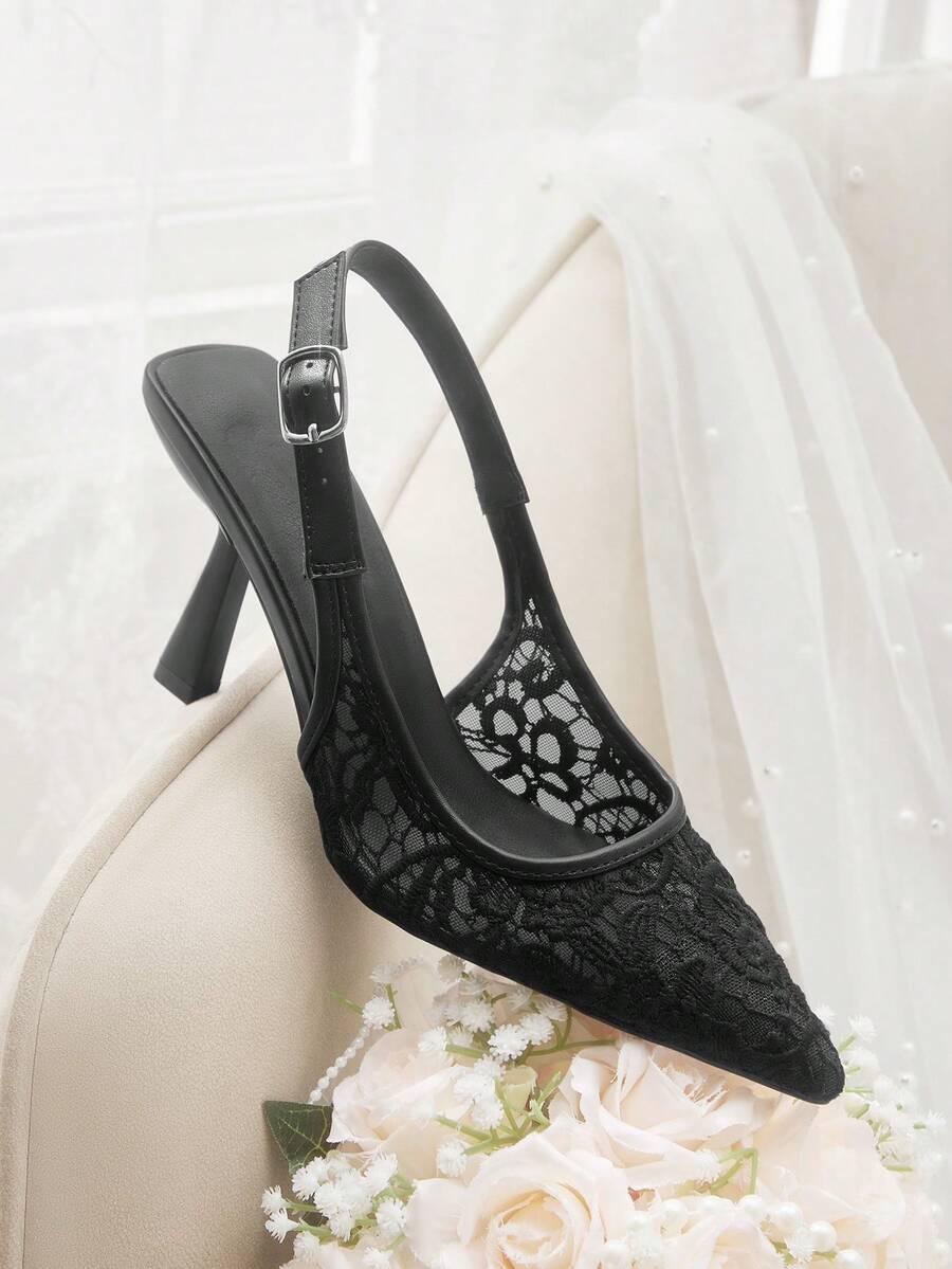 Pointed toe stiletto high heel pumps featuring black lace mesh upper, buckle slingback detail, and sleek slip-on design for weddings and evening wear.