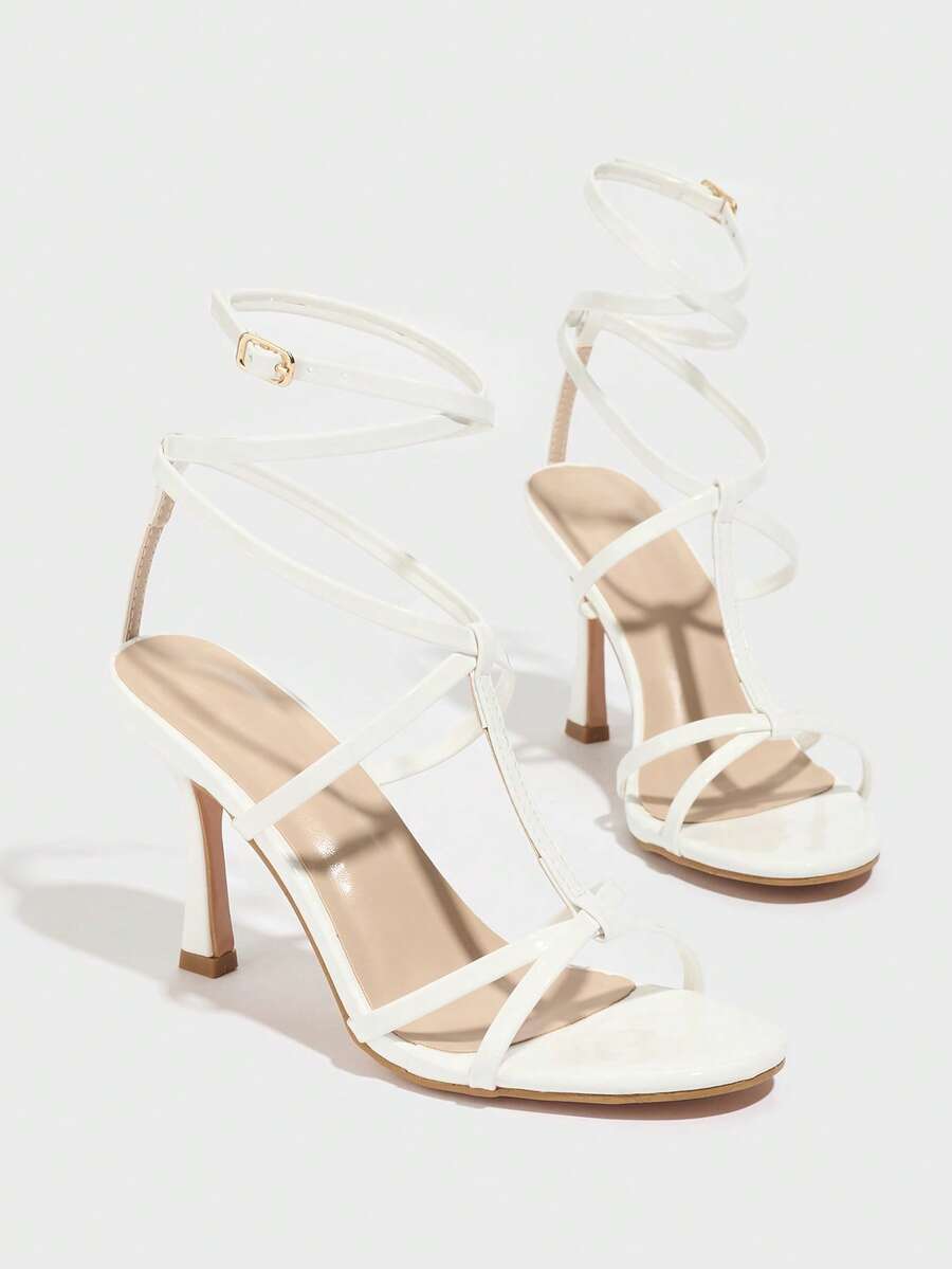 Women's open round toe high heel sandals with thin stiletto heel, hollow strap design, and ankle buckle closure.
