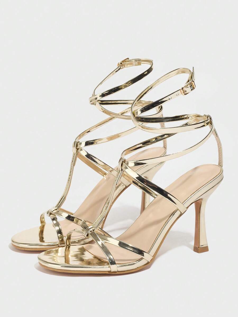 Women's open round toe high heel sandals with thin stiletto heel, hollow strap design, and ankle buckle closure.