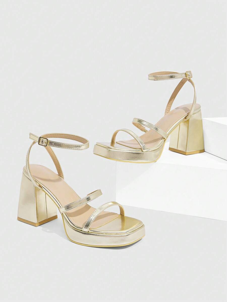 Women's high-heeled sandals with textured pattern, open toe design, chunky heel, and adjustable ankle buckle strap.