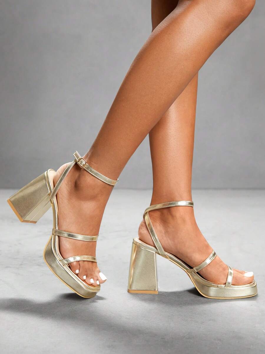 Women's high-heeled sandals with textured pattern, open toe design, chunky heel, and adjustable ankle buckle strap.
