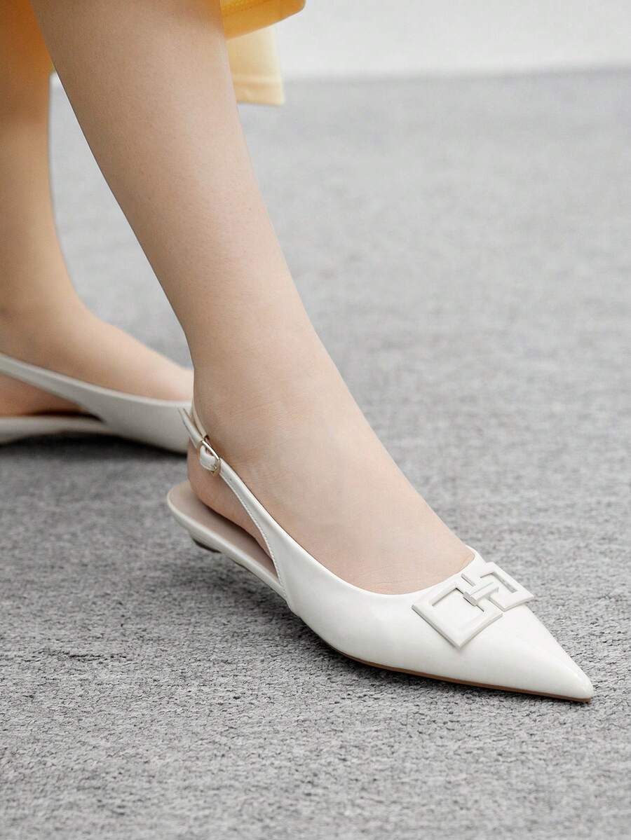 Women's pointed toe low wedge flat shoes crafted in PU leather with a slingback strap and stylish metal buckle detail.