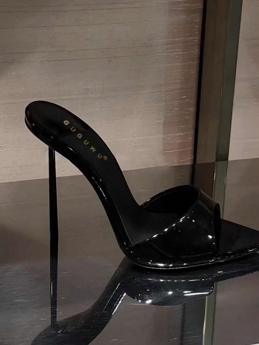 Patent leather open toe slingback slide sandals with stiletto high heels and slip on design.