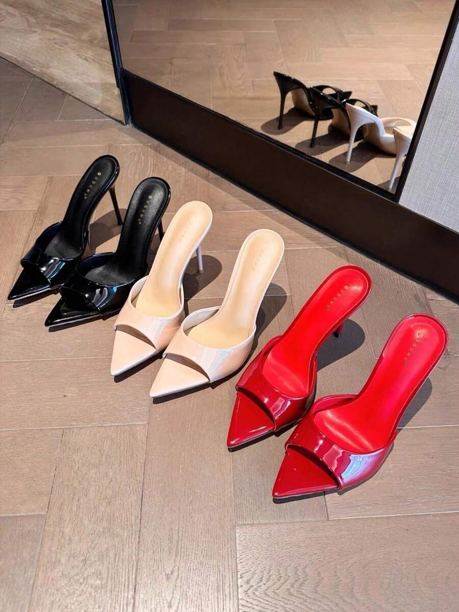 Patent leather open toe slingback slide sandals with stiletto high heels and slip on design.