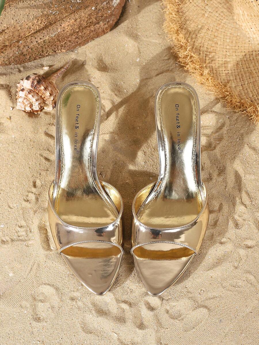 Women's open toe slide sandals featuring sleek patent leather and thin stiletto heels
