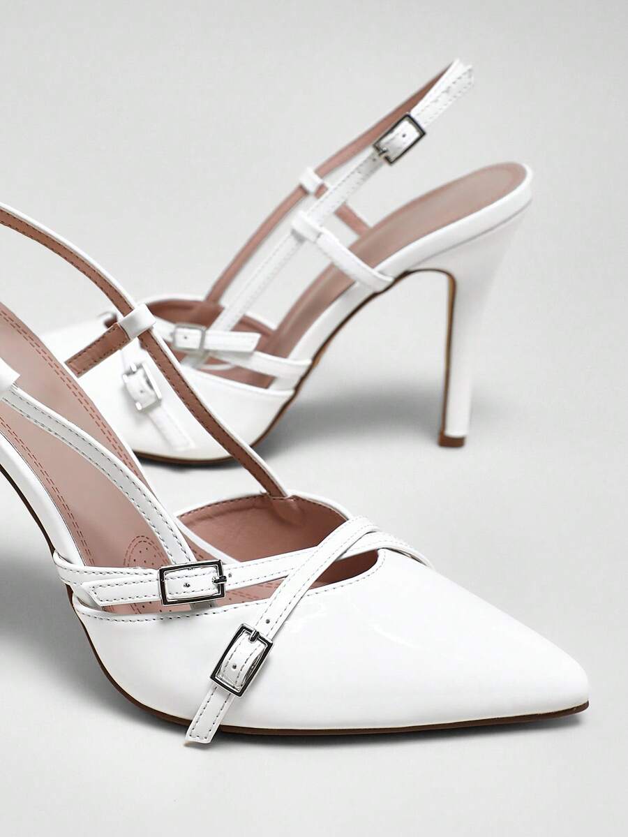Women's pointed toe stiletto heel slingback pumps in chocolate brown with double metal buckle strap details.